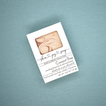 Load image into Gallery viewer, Cream, rose clay pink and gold swirled artisan soap bar packaged in a white box. Coconut Rose Soap Supreme is formulated of luxurious cocoa butter, organic coconut milk, and our botanical oil blend infused with cruelty-free silk, fragranced to perfection - it’s a little coconut-y, a little vanilla-y, IT. IS. STUNNING. The fragrance profile is a sweet and soft mix of coconut, candy apple, raspberry, red currant, tulip, freesia, heliotrope, rose, cashmere musk, vanilla, and amber.  Skin Joy Soap Murfreesboro