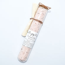 Load image into Gallery viewer, Rose pink bath soak in glass tube. Coconut Rose Bath Soak is a luxurious blend of sea salts and organic coconut milk. The best selling scent is the same fragrance as our companion soap bar Coconut Rose Soap Supreme - a sweet and soft mix of coconut, candy apple, raspberry, red currant, tulip, freesia, heliotrope, rose, cashmere musk, vanilla, and amber. Skin Joy Soap Murfreesboro Tennessee