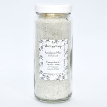 Load image into Gallery viewer, Light green bath salt soak in glass jar. Eucalyptus Mint Bath Soak is a refreshing blend of sea salts, epsom salt and fine fragrance. Experience a unique twist on the classic eucalyptus mint scent with this customer favorite, featuring rosemary, peppermint, spearmint and refreshing eucalyptus. Skin Joy Soap Murfreesboro Tennessee