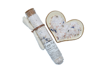 Load image into Gallery viewer, Lavender Botanical Bath Salt Soak in glass jar and heart bowl. Lavender Oat Bath Soak is a gentle blend of sea salts and colloidal oats. This best selling scent is the same lovely fragrance as our soap supreme bar “Lavender Sage” - top notes of rosemary and thyme, heart notes of lavender and sage, and base notes of powder and musk, this essential oil fragrance oil blend is a classic clean herbaceous dream. Skin Joy Soap Murfreesboro Tennessee