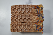 Load image into Gallery viewer, Honey gold bar soap with wildflower botanicals. Handcrafted Natural Soap:, Local Honey's fragrance profile is sweet and an oh so yummy traditional honey scent – you may even be tempted to lick your bar, but of course we advise against it. Local Honey Joy Bar is formulated of nourishing botanical oils and organic coconut milk infused with turmeric, luxurious silk fibers and 100% pure dark wildflower honey made right here in Tennessee. Skin Joy Soap Murfreesboro Tennessee
