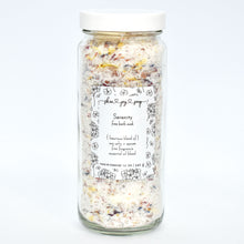 Load image into Gallery viewer, Luxurious bath salt soak with botanicals in glass jar. Serenity Bath Soak is a relaxing blend of sea salts and epsom salt. The calming aroma is crafted of Bulgarian lavender and geranium essential oils blended with fine fragrance to elevate the bathing ritual...we really should have named this one Mellow Mood.