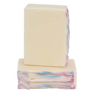 Creamy white bar soap with top swirls of blue pink and purple