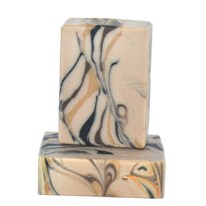 Marbled artisan amber soap bars with swirls of gold, bronze, and black. 