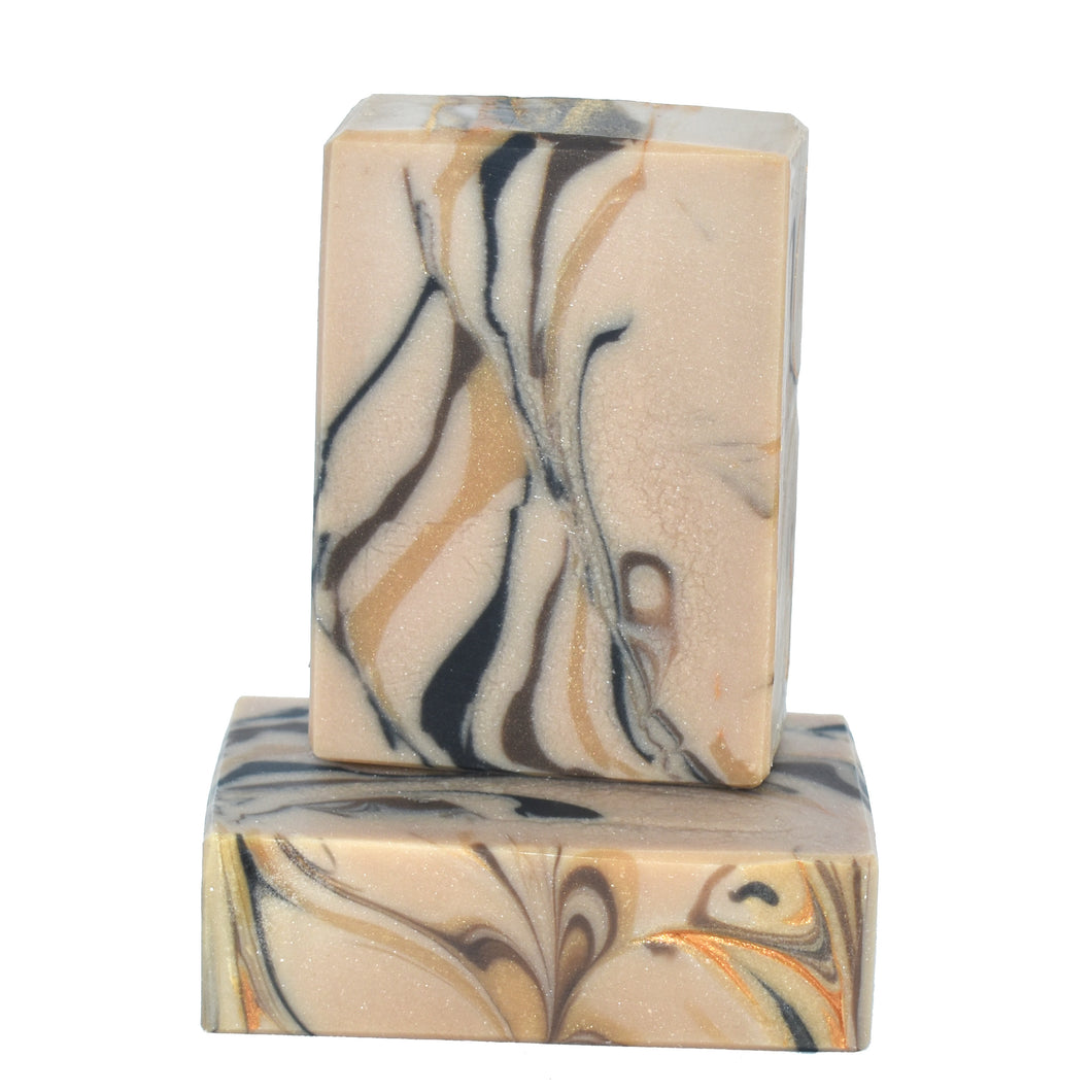 Marbled artisan amber soap bars with swirls of gold, bronze, and black. 