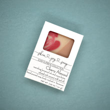 Load image into Gallery viewer, Tan, cream, red and gold cherry almond soap in white box
