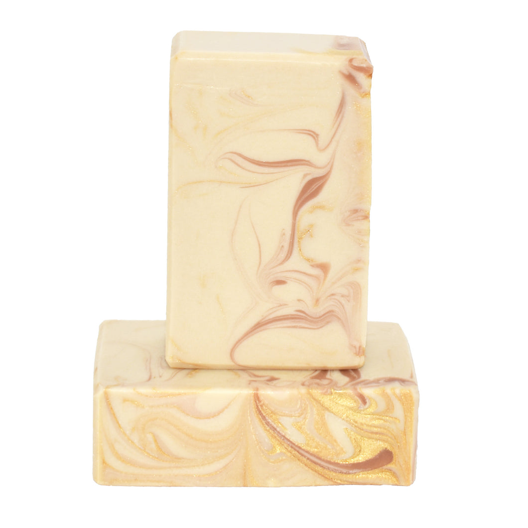 Cream, rose clay pink and gold swirled artisan soap bar.  Best selling Coconut Rose is what Soap Supreme is all about – luxurious cocoa butter, organic coconut milk, and our botanical oil blend infused with cruelty-free silk, fragranced to perfection - it’s a little coconut-y, a little vanilla-y, IT. IS. STUNNING.  The fragrance profile is a sweet and soft mix of coconut, candy apple, raspberry, red currant, tulip, freesia, heliotrope, rose, cashmere musk, vanilla, and amber. 