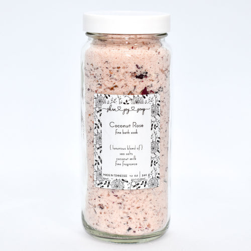 Rose pink bath soak in glass jar.  Coconut Rose Bath Soak is a luxurious blend of sea salts and organic coconut milk.  The best selling scent is the same fragrance as our companion soap bar Coconut Rose Soap Supreme  - a sweet and soft mix of coconut, candy apple, raspberry, red currant, tulip, freesia, heliotrope, rose, cashmere musk, vanilla, and amber.  Skin Joy Soap Murfreesboro Tennessee