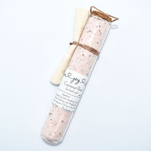 Load image into Gallery viewer, Rose pink bath soak in glass tube. Coconut Rose Bath Soak is a luxurious blend of sea salts and organic coconut milk. The best selling scent is the same fragrance as our companion soap bar Coconut Rose Soap Supreme - a sweet and soft mix of coconut, candy apple, raspberry, red currant, tulip, freesia, heliotrope, rose, cashmere musk, vanilla, and amber. Skin Joy Soap Murfreesboro Tennessee
