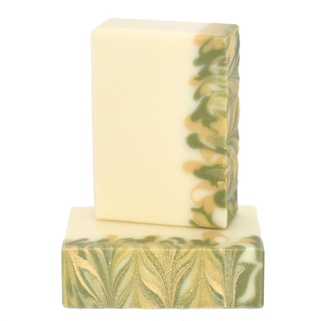 Ivory white with green and gold swirls bar soap.  Handcrafted Luxury Natural Soap: A Soap Supreme bar, Gilded Pear is formulated of nourishing botanical oils and cocoa butter, infused with organic coconut milk, luxurious silk fibers and kaolin clay. This fruity fragrance smells of crisp Anjou pears and all that glistens.  Skin Joy Soap Murfreesboro Tennessee