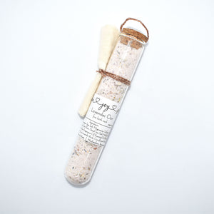 Lavender Botanical Bath Salt Soak in glass tube.  Lavender Oat Bath Soak is a gentle blend of sea salts and colloidal oats.  This best selling scent is the same lovely fragrance as our soap supreme bar “Lavender Sage” -  top notes of rosemary and thyme, heart notes of lavender and sage, and base notes of powder and musk, this essential oil fragrance oil blend is a classic clean herbaceous dream.   Skin Joy Soap Murfreesboro Tennessee