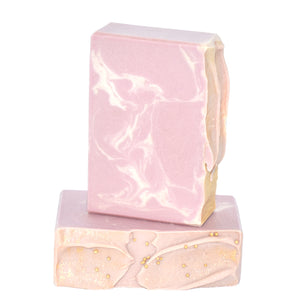 Pink, white and gold swirled artisan soap bars. Handcrafted Luxurious Natural Bar Soap: A luxury spa scent, this fragrance is an essential oil/fragrance oil blend of patchouli, ylang ylang, and orange deepened with the exotic and earthy scent of amber, reminiscent of our favorite salon.  Lavish Soap Supreme bar is formulated of nourishing botanical oils and cocoa butter infused with organic coconut milk and luxurious silk fibers.  Skin Joy Soap Murfreesboro Tennessee