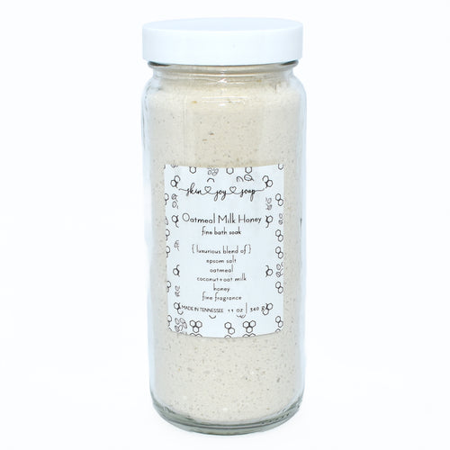 Creamy white bath salt soak in glass jar.  Oatmeal Milk and Honey Bath Soak in 12 oz glass jar.  Skin Joy Soap Murfreesboro Tennessee