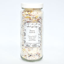 Load image into Gallery viewer, Luxurious bath salt soak with botanicals in glass jar. Serenity Bath Soak is a relaxing blend of sea salts and epsom salt.  The calming aroma is crafted of Bulgarian lavender and geranium essential oils blended with fine fragrance to elevate the bathing ritual...we really should have named this one Mellow Mood. 
