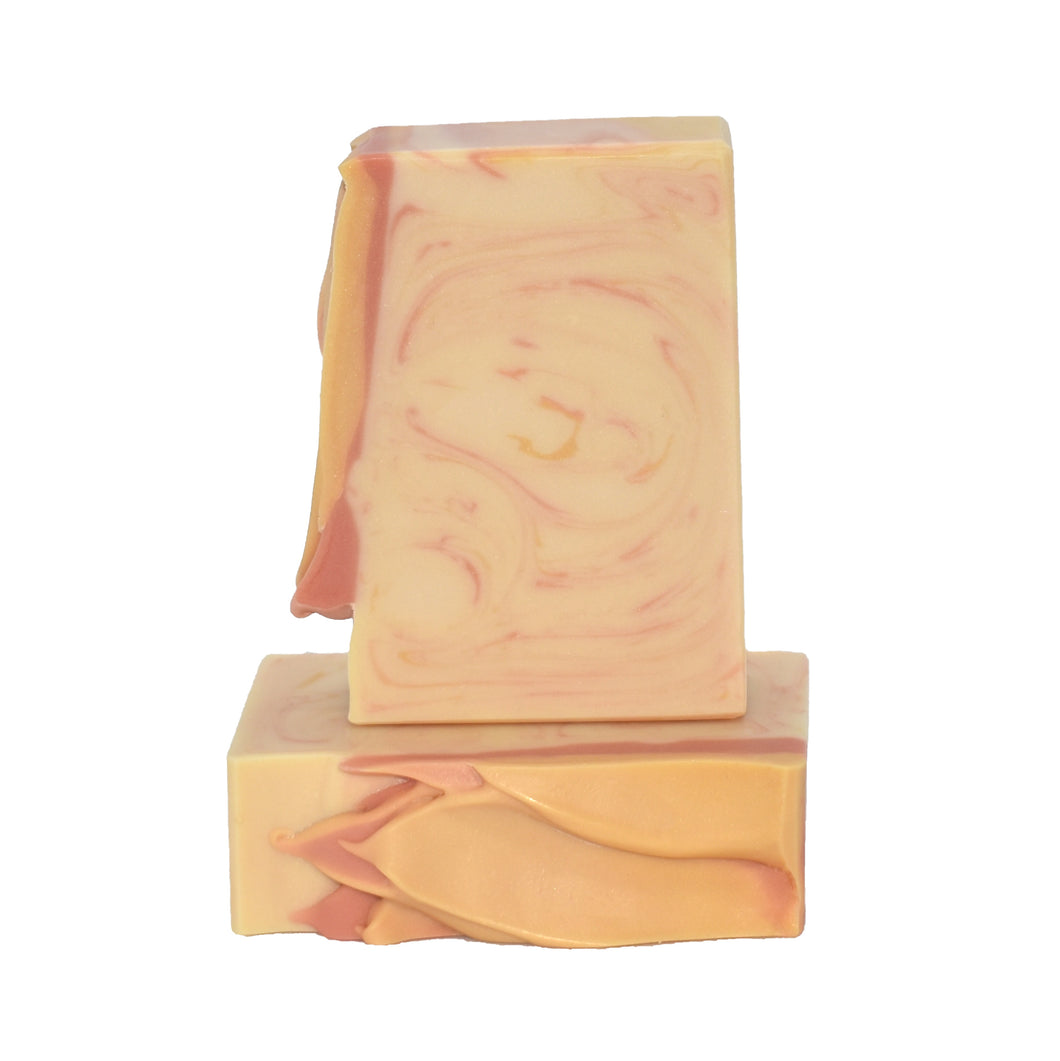 Cream and peachy orange artisan soap bars. Handcrafted Natural Soap: A bright lemon bar as divine as a Sunday morning sunrise!  Sunday Morning Soap Supreme bar is formulated of nourishing botanical oils and cocoa butter infused with organic coconut milk, kaolin clay, and luxurious silk fibers.  Skin Joy Soap Murfreesboro Tennessee